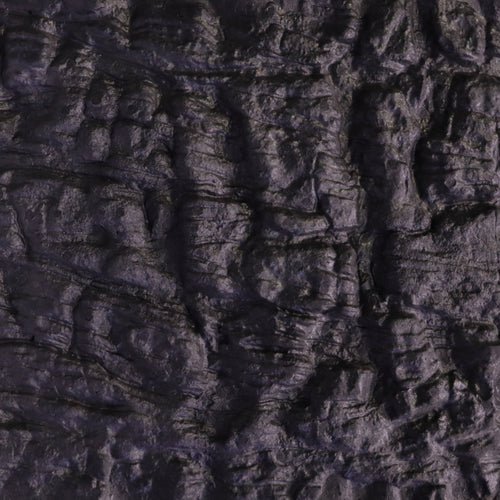 Close-up of dark, textured, wrinkled fabric or material with uneven folds.