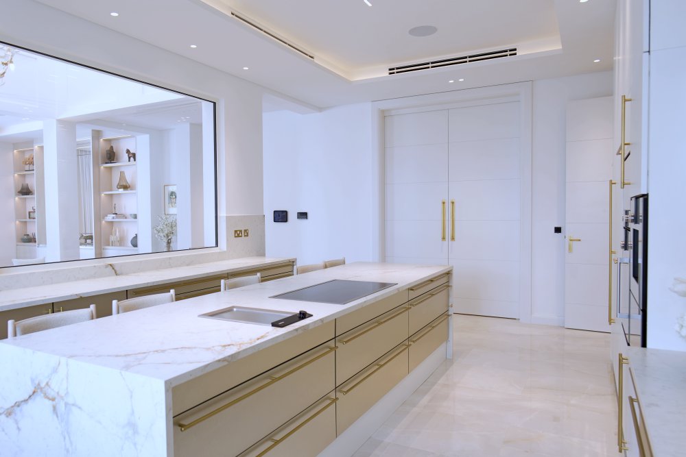 Spacious luxury kitchen with marble island in Al Barari villa renovation Dubai