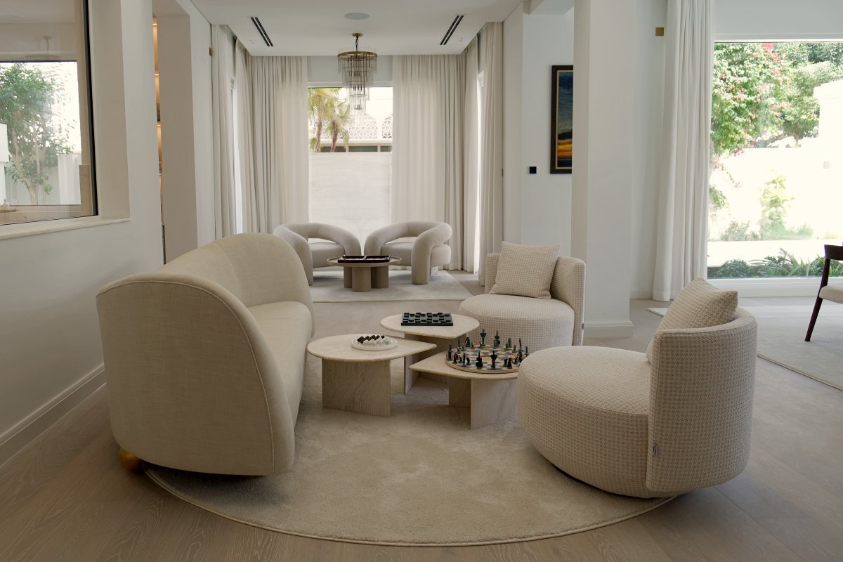 Elegant circular seating arrangement in living room of Al Barari villa renovation Dubai