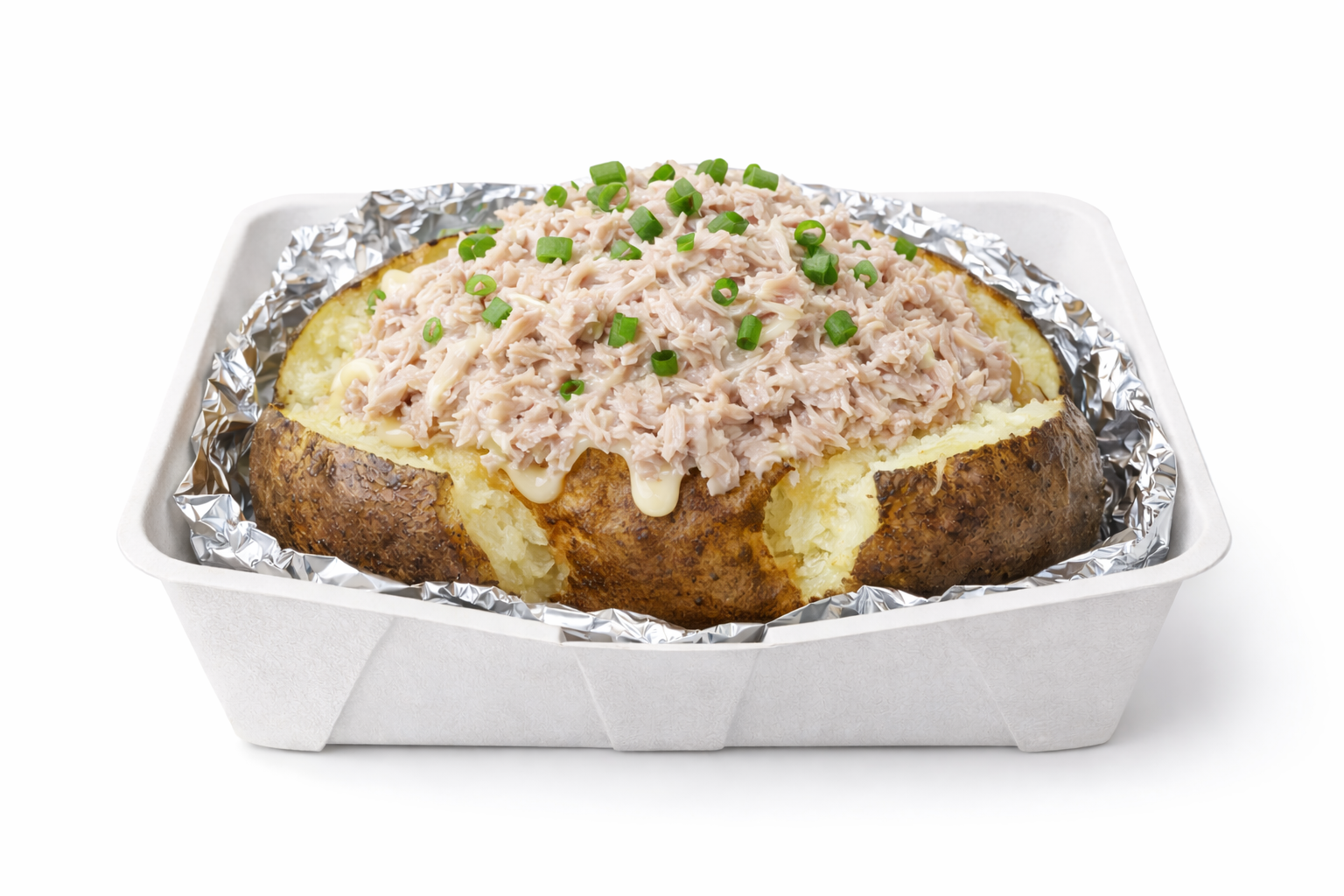 Baked potato topped with creamy tuna and chopped green onions in foil-lined takeout container.