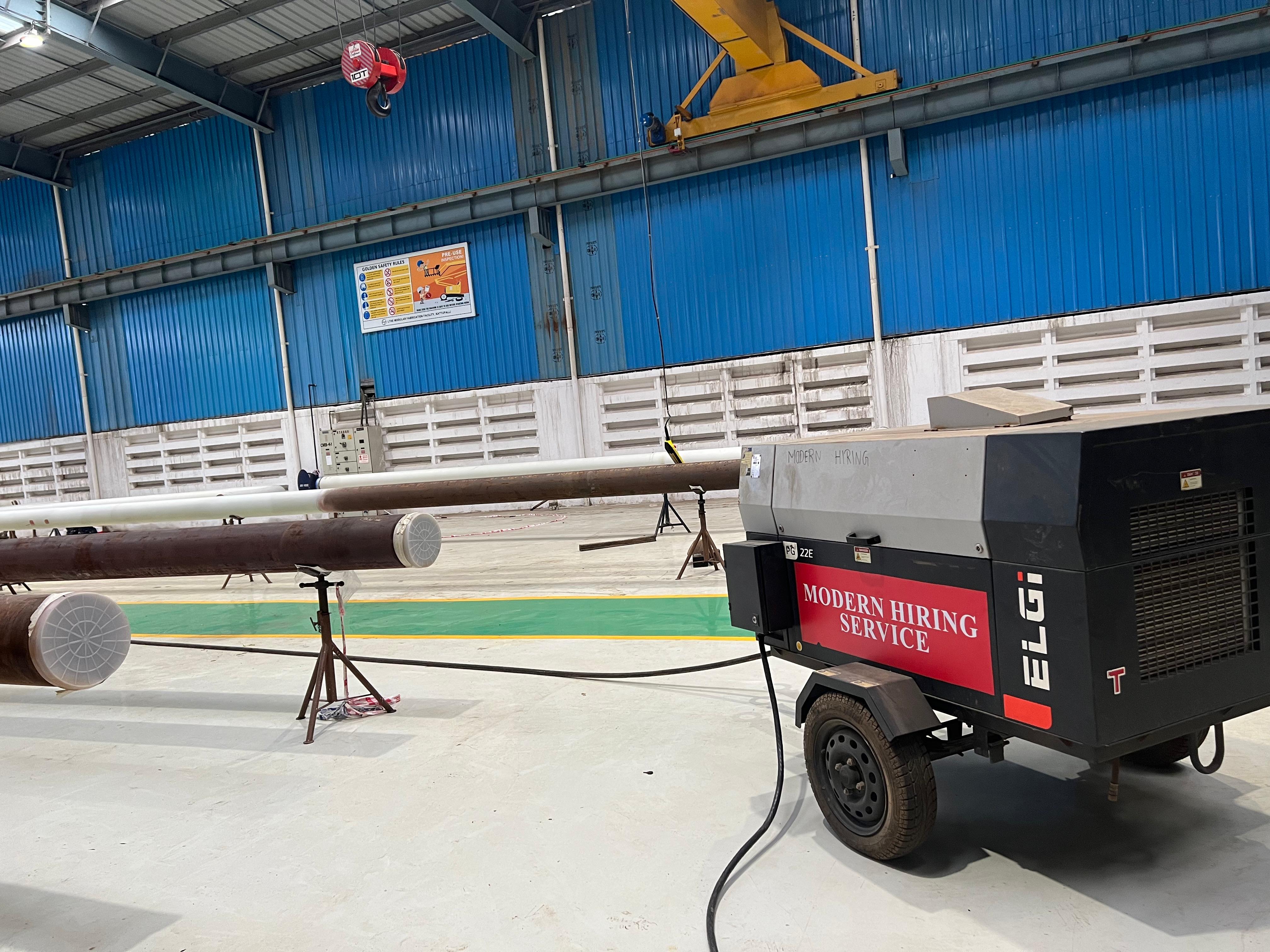 Mobile industrial generator trailer with ELGi branding and model PG 450-150 in black and gray.