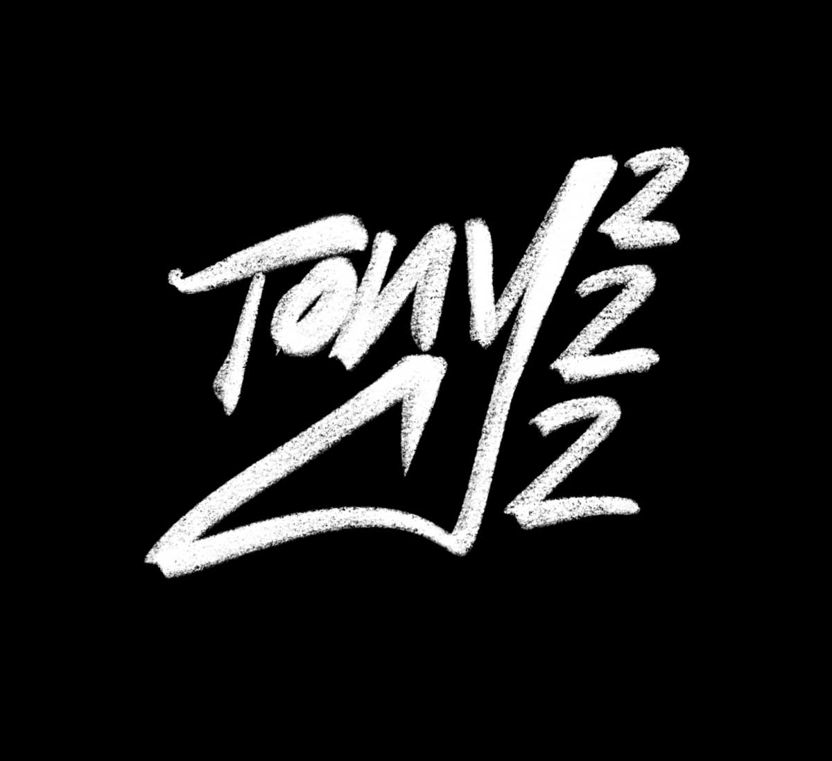 White chalk-style graffiti text spelling 'Tony 2 1/2 2' on a black background.