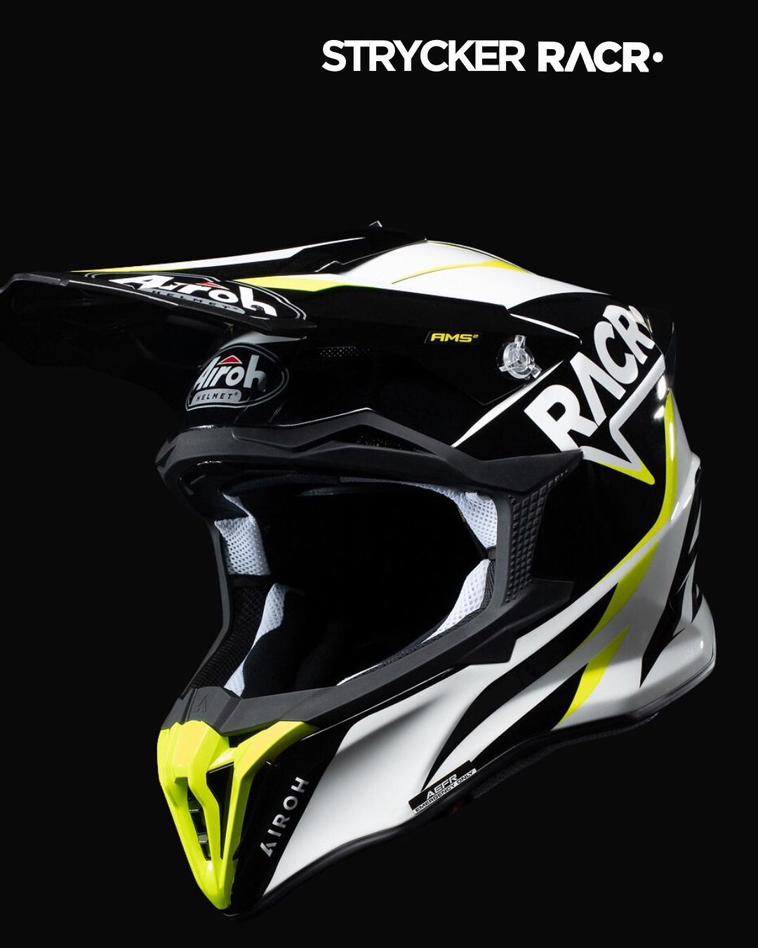 Black, white, and yellow Airoh Strycker Racr motocross helmet with ventilation details.