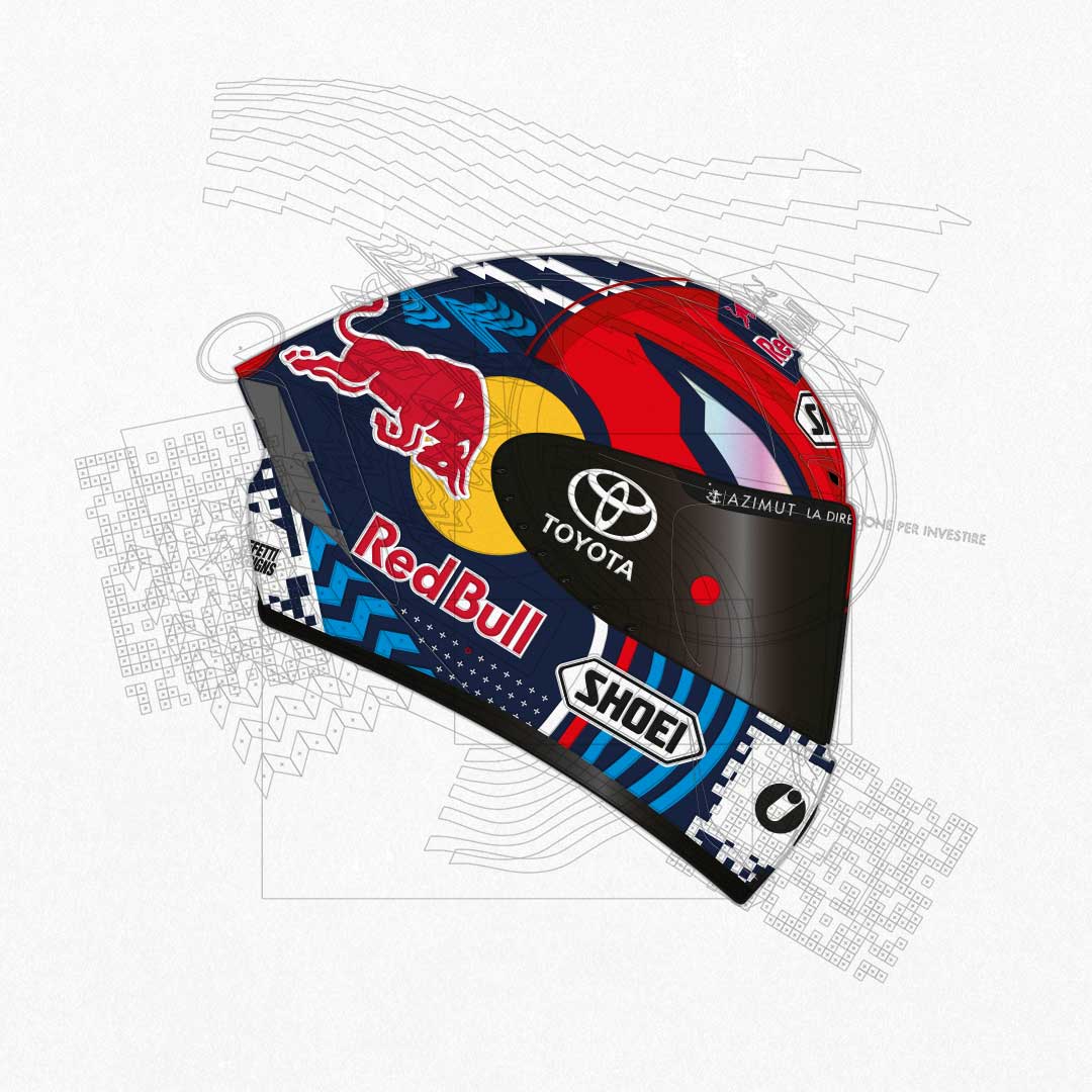 Racing helmet with Red Bull, Toyota, Shoei logos and a blue, red, and yellow design.