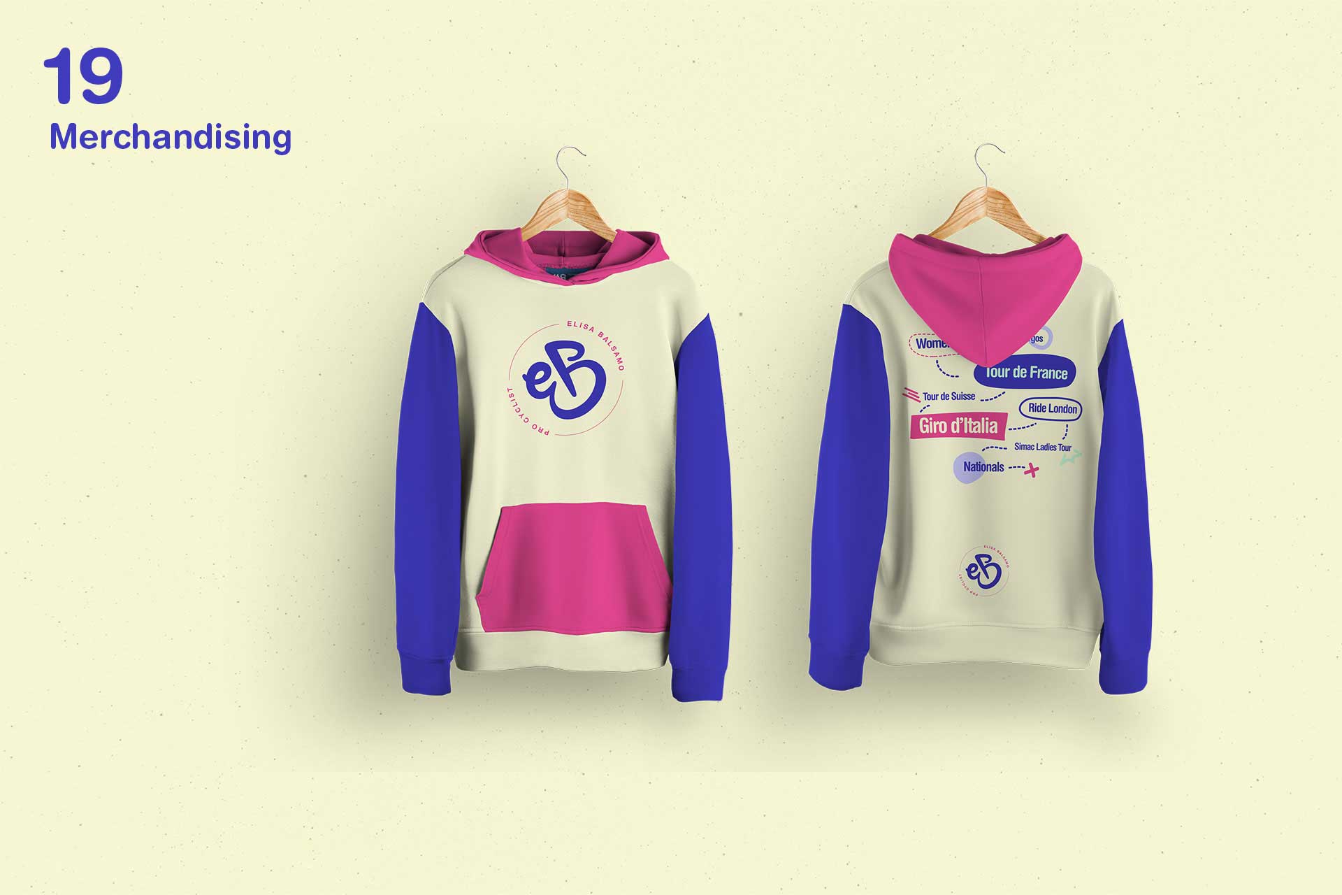 Front and back view of a hoodie with blue sleeves, pink hood and pocket, and cycling-themed logos and text.