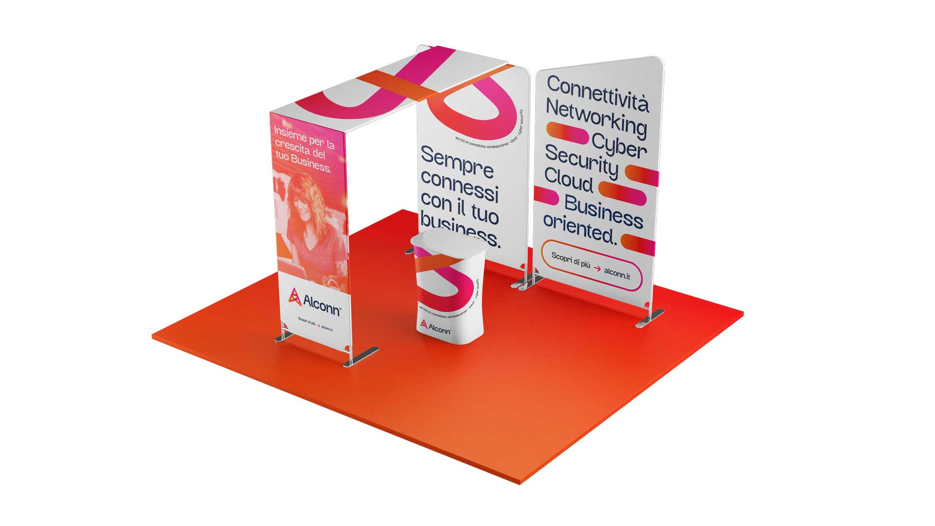 Alconn trade show exhibit with three white panels featuring business connectivity and networking text in Italian, an image of a smiling woman, and a branded counter on an orange floor.