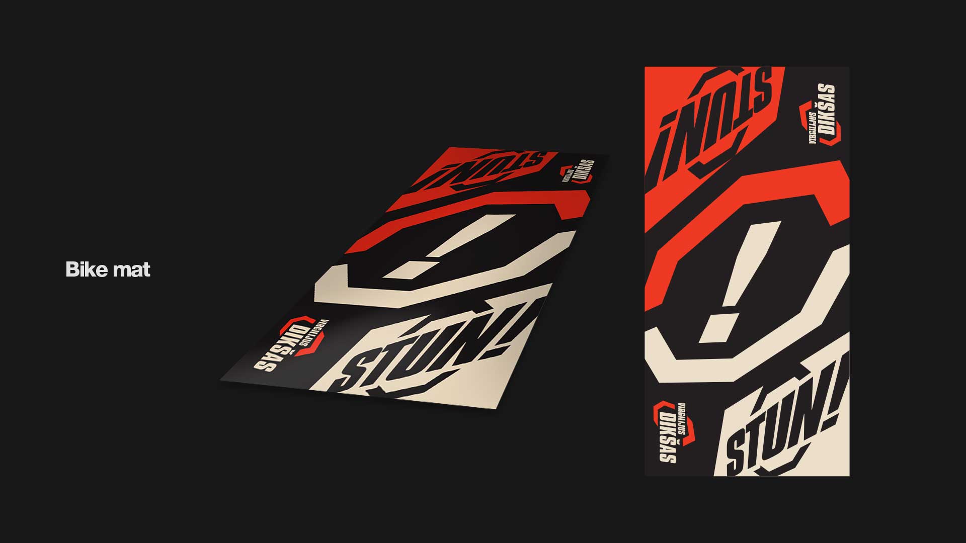 Bike mat with bold graphic design featuring large exclamation mark and text 'STUN!' in red, black, and cream colors.