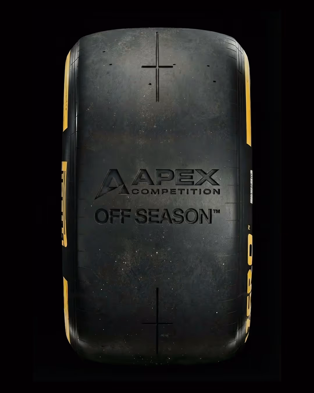 Top view of a Pirelli Apex Competition Off Season racing tire with worn surface and yellow sidewall accents.