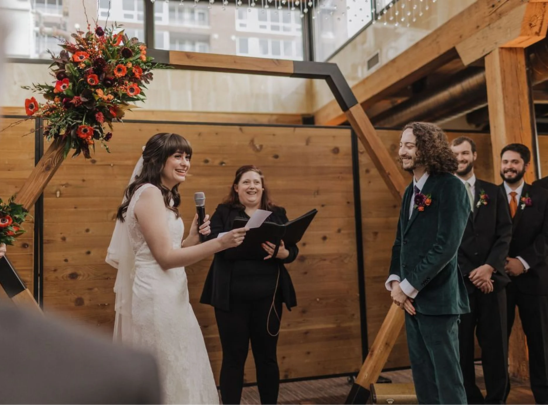 A couple standing in front of the officiant