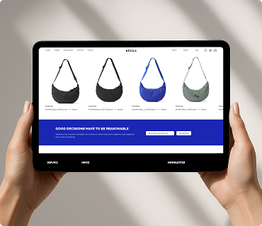 Tablet screen showing four stylish crossbody bags in different colors (black, dark blue, blue, olive green) with product names and prices on a shopping website.