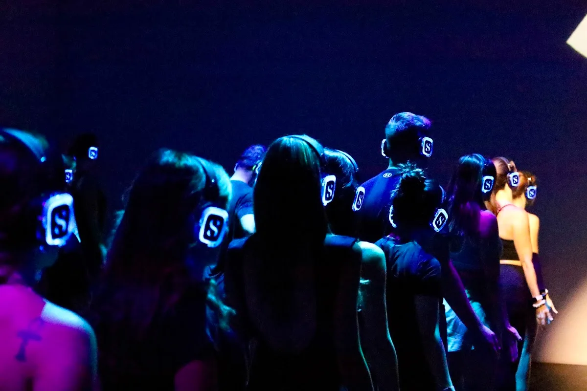 Glowing Sanctum headphones in the crowd at TODA