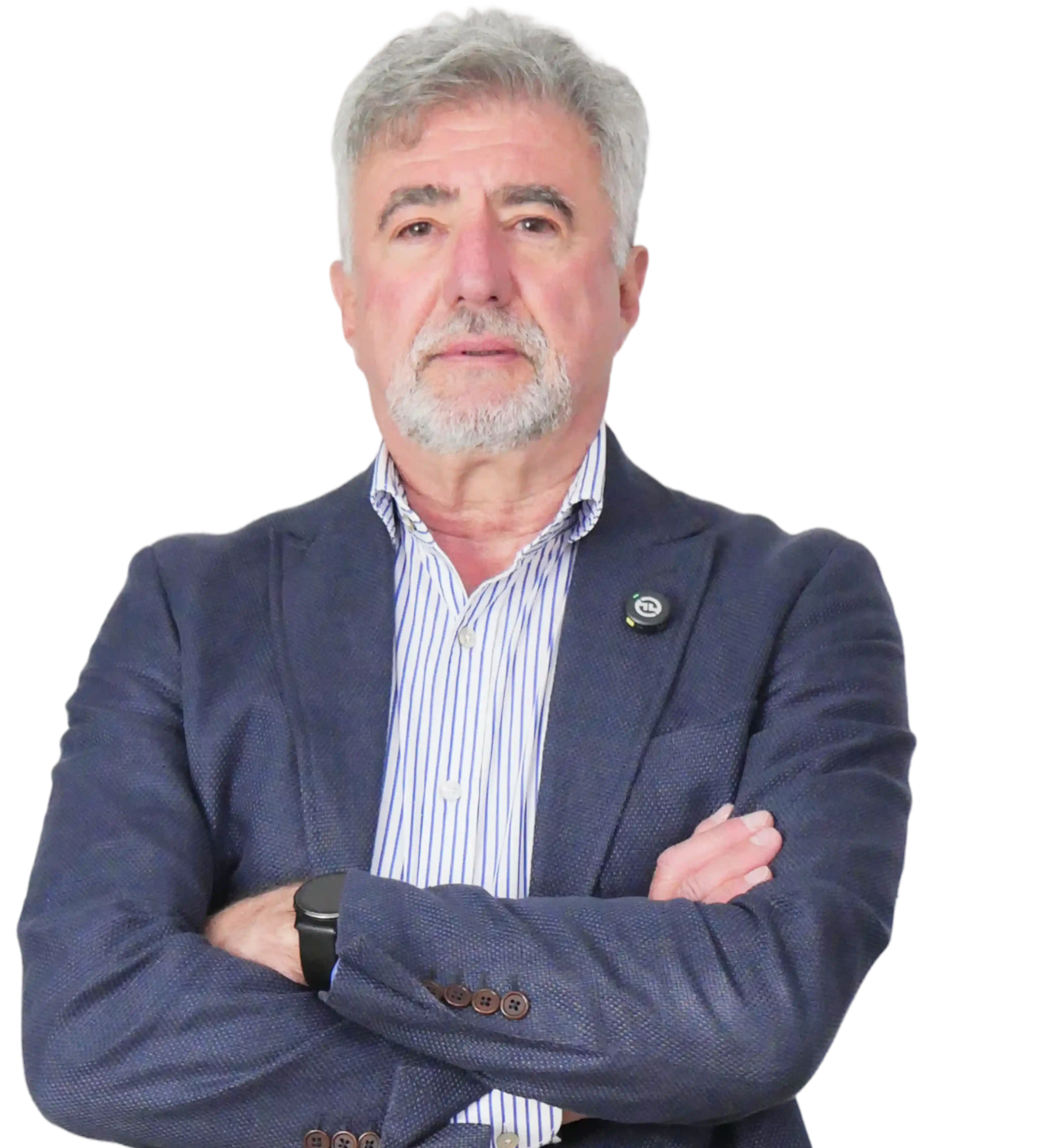 Nigel Saperia wearing a striped shirt and blue blazer with arms crossed.