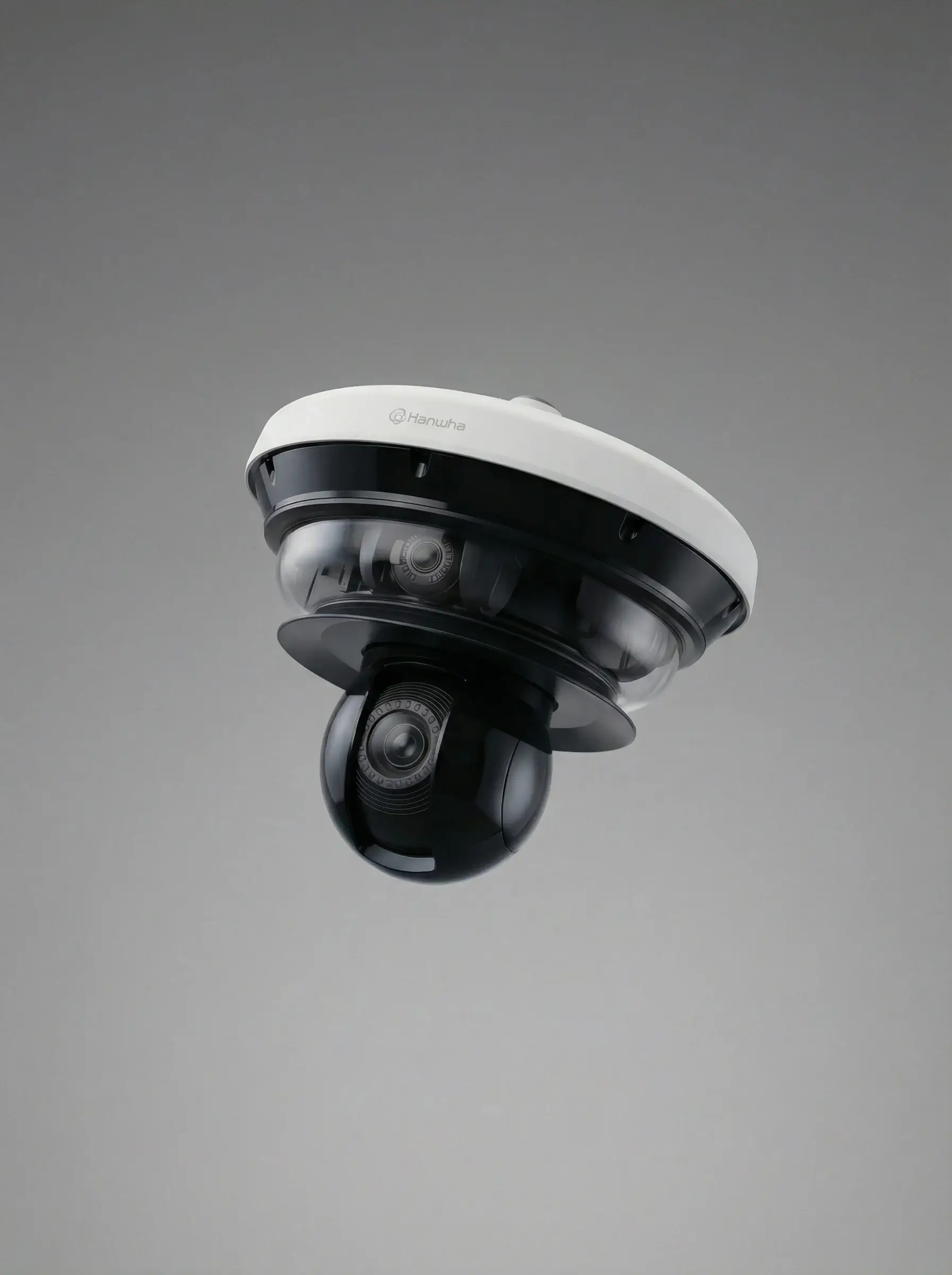 Dome security camera with black and white casing labeled Hanwha on a gray background.
