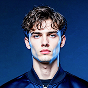 man in blue bomber jacket