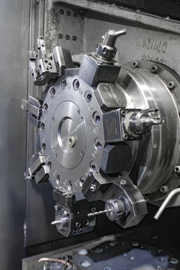 A close up of a machine that is working on a piece of metal