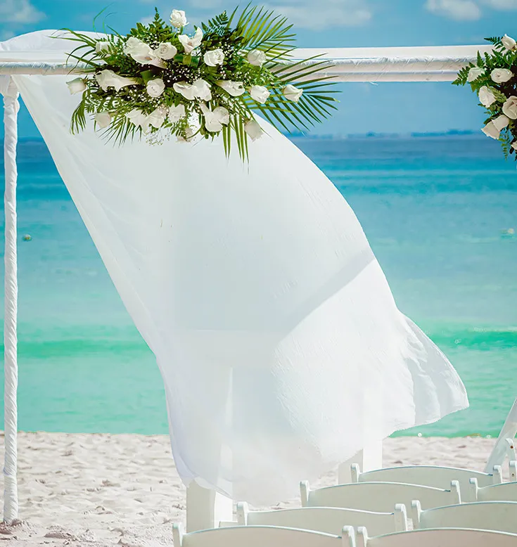 Alley decorated for an outdoor wedding ceremony at La Créole Beach Hotel & Spa in Le Gosier.