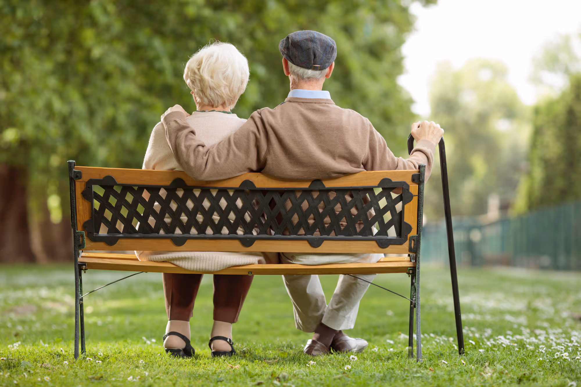 Couple sitting on a bench stock image