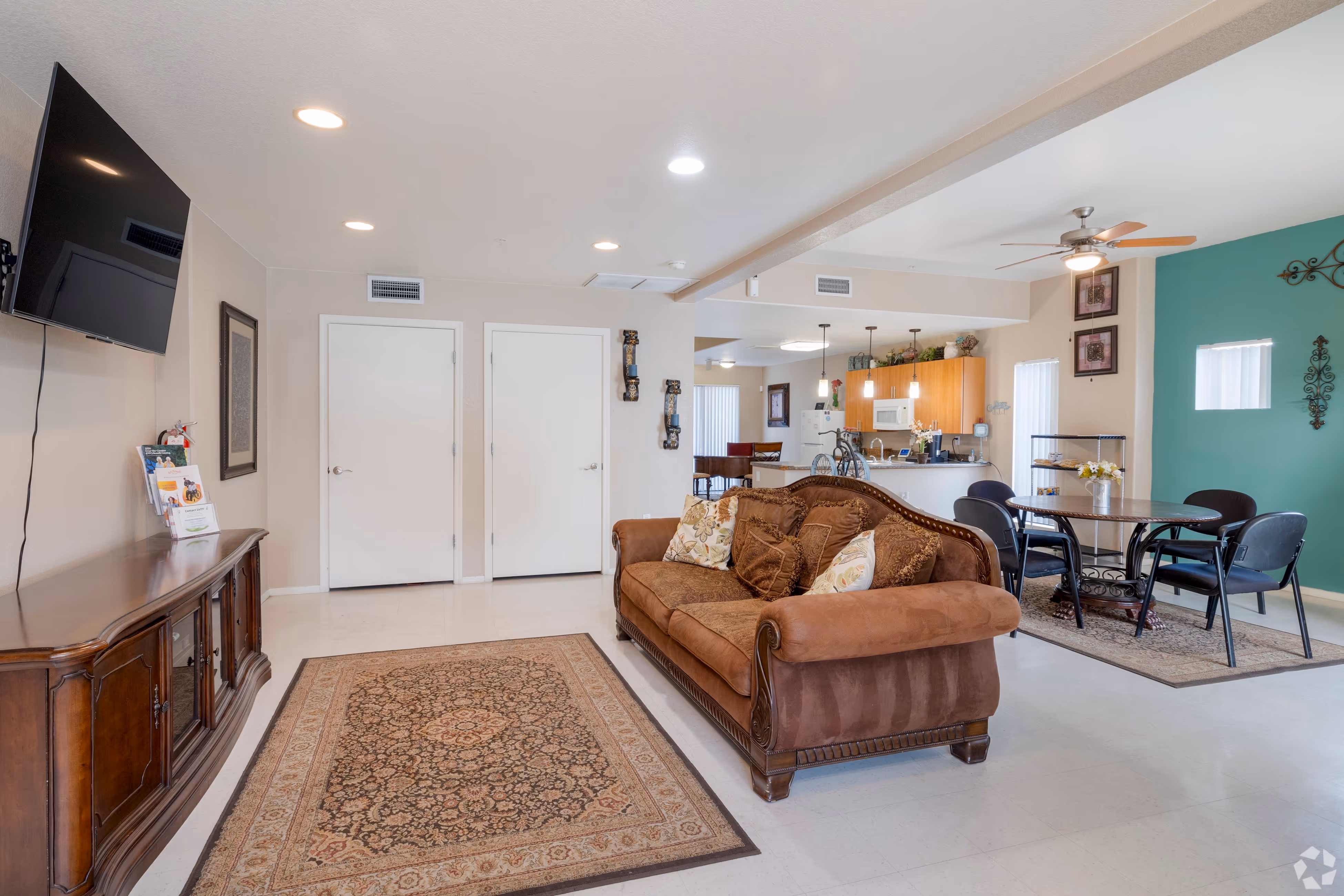 Clubhouse room with lounge seating and television