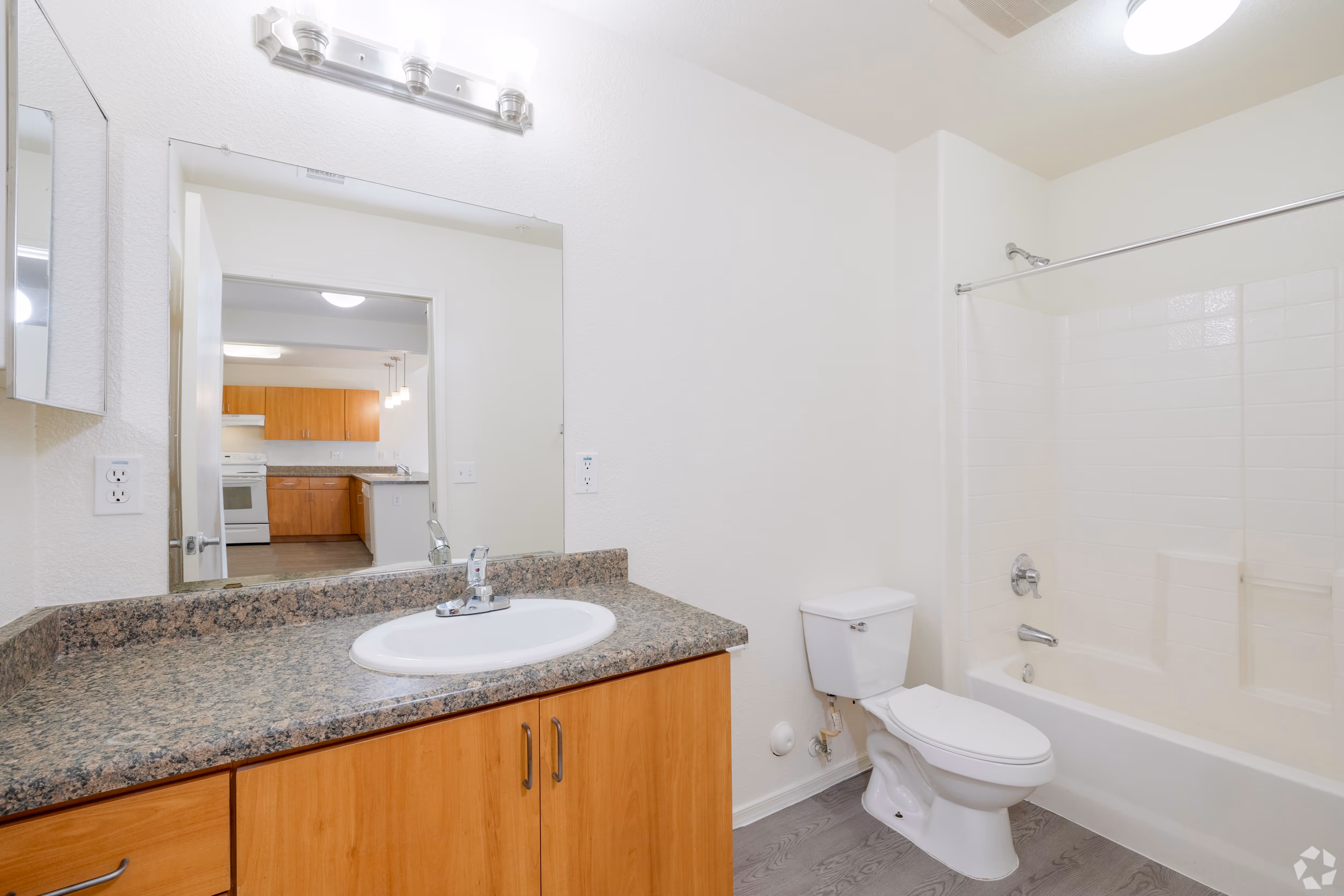 Empty bathroom with vanity and full shower