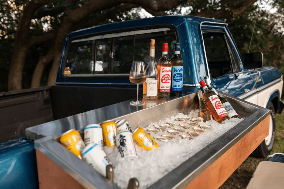A truck with oysters and beverages on ice.
