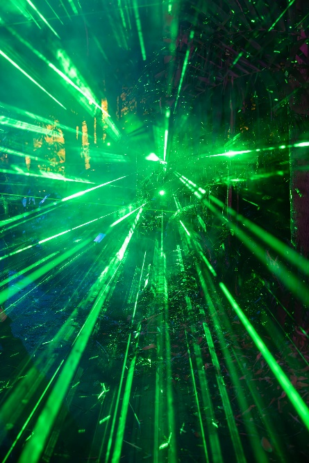 image of green light splitting through a prism