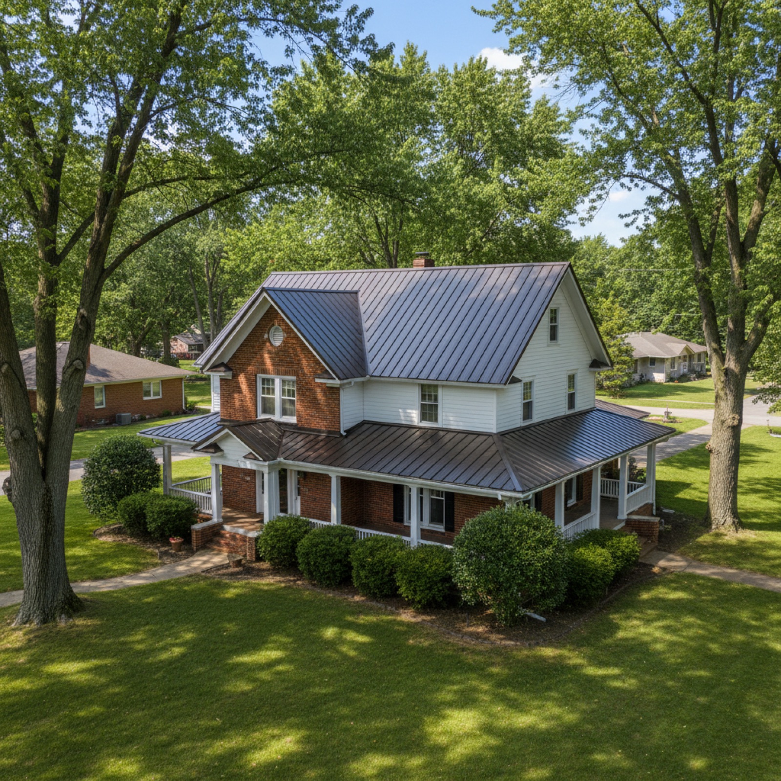 New standing-seam metal roof on an older two-story home near Rising Sun, IN