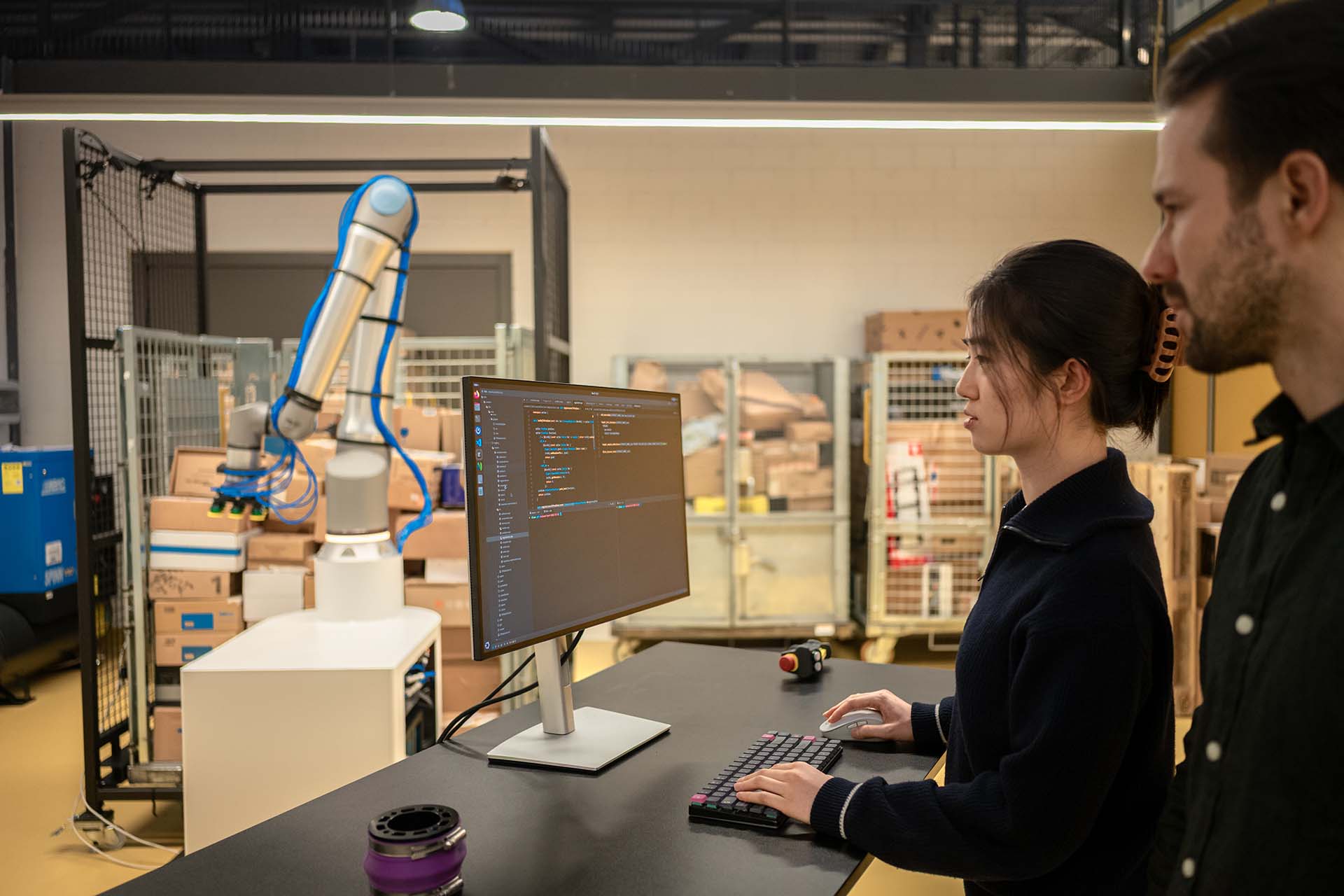Two people collaborating at a lab computer