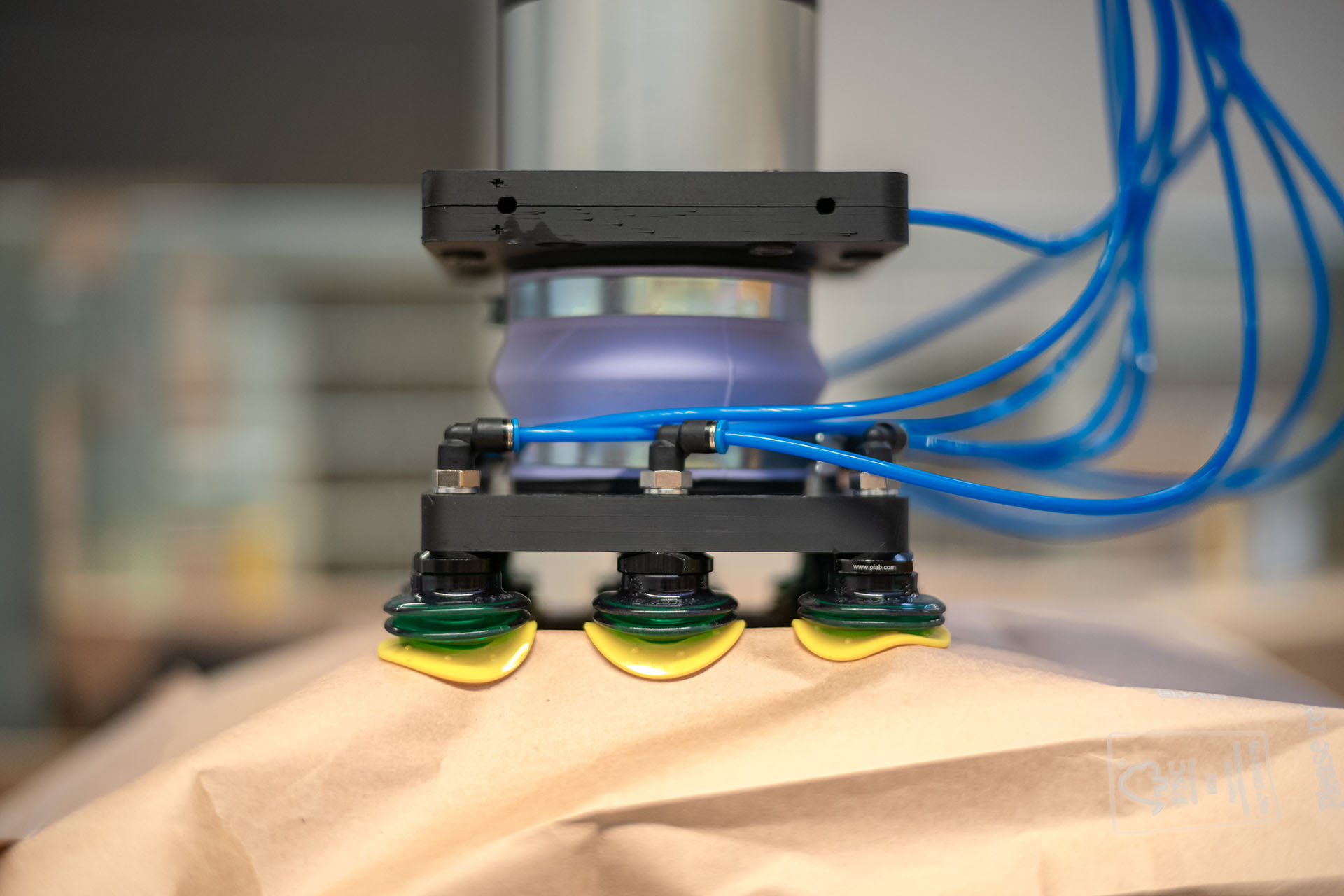 Close up of Flinkbot gripper lifting a package