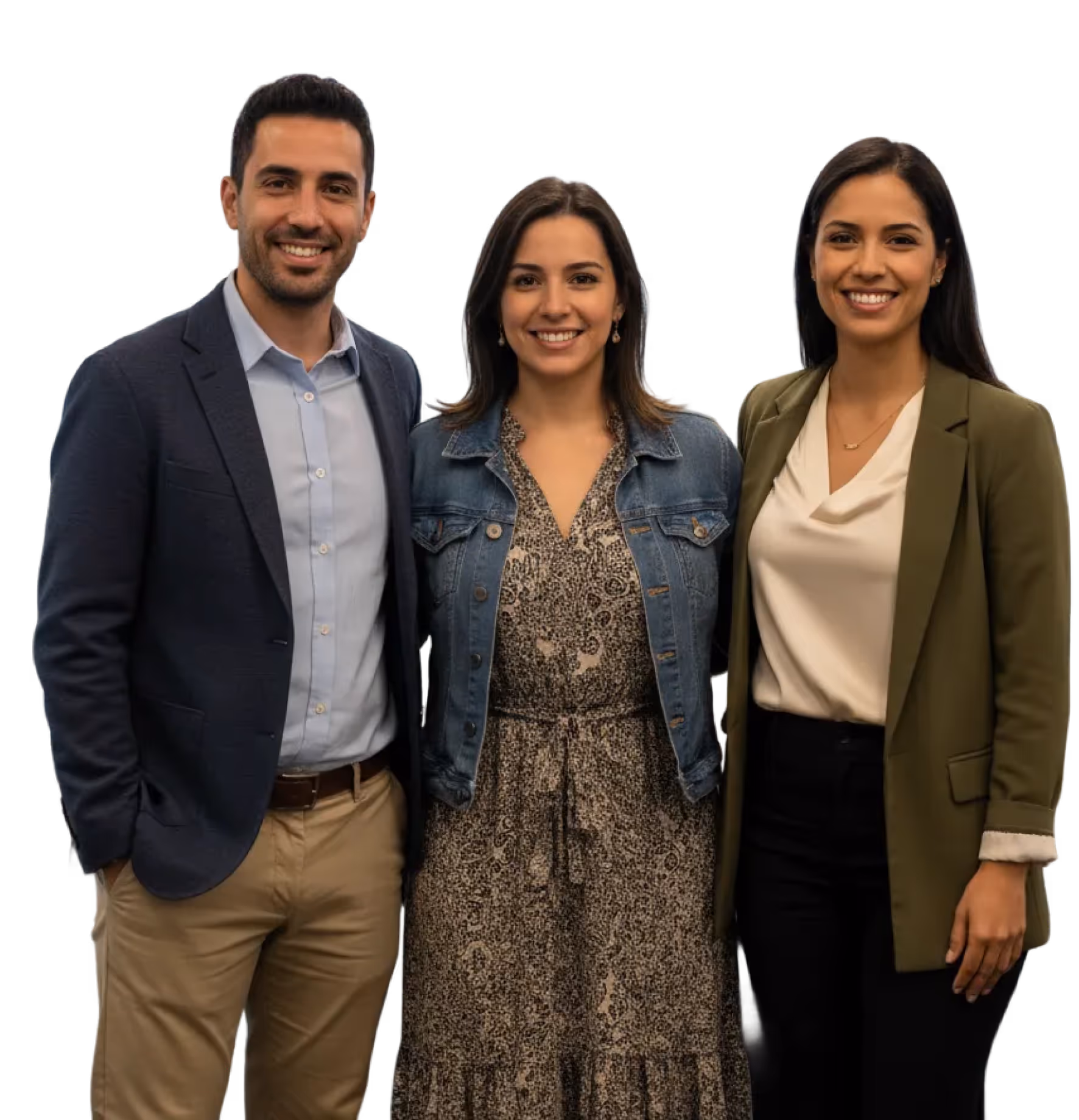 Three smiling young professionals standing together, dressed in business casual attire.