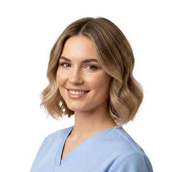 Smiling woman with short blonde hair wearing a light blue medical scrub top.