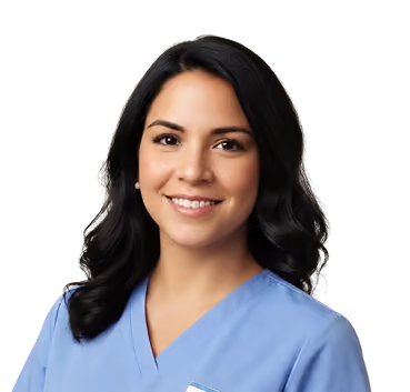 Smiling woman with shoulder-length black hair wearing a purple V-neck top.