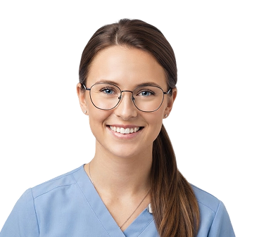 Smiling young woman in light blue medical scrubs with brown hair tied back and round glasses.