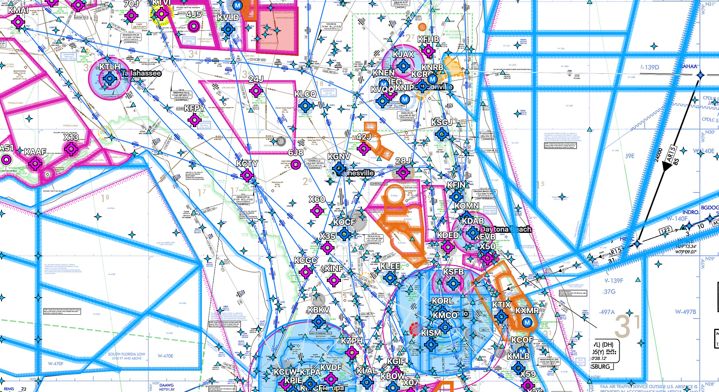 Section of an aeronautical chart showing airports, airways, and navigational aids around Florida with various symbols, blue and magenta airspace boundaries, and waypoint markers.
