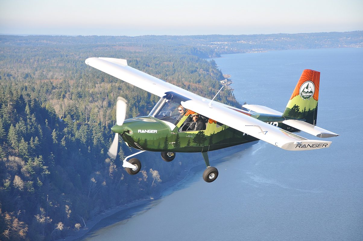 Vashon Ranger R7 banking over a forested coastline