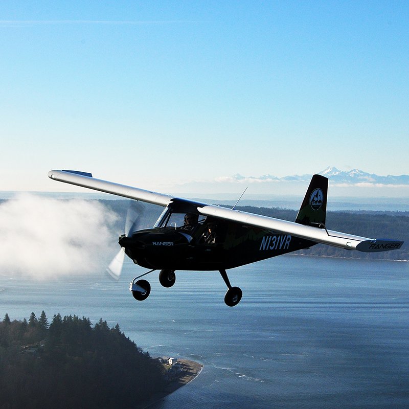 Vashon Ranger R7 cruising along the coastline above clouds.
