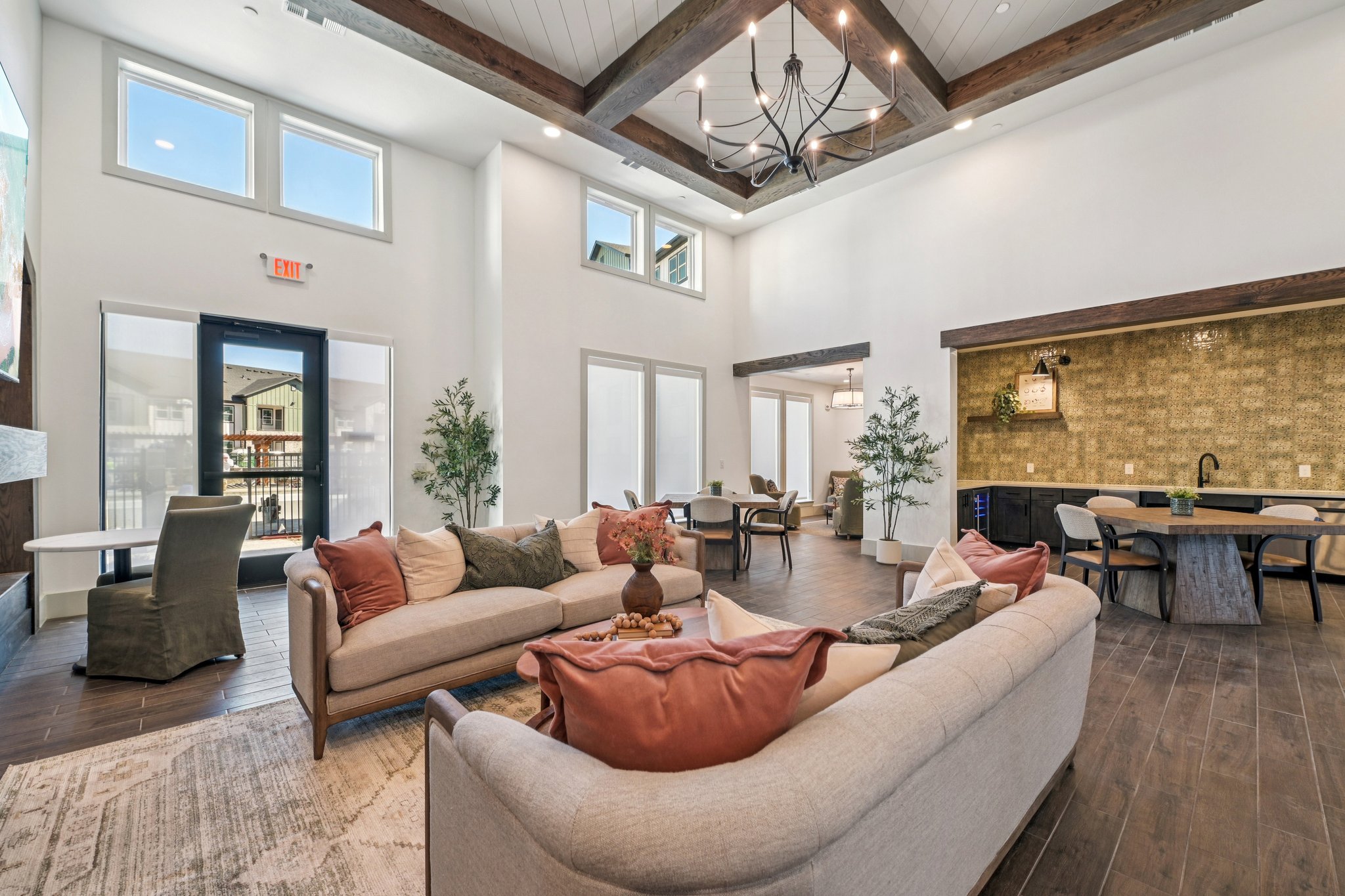 Community room with sofas, tables, and chairs