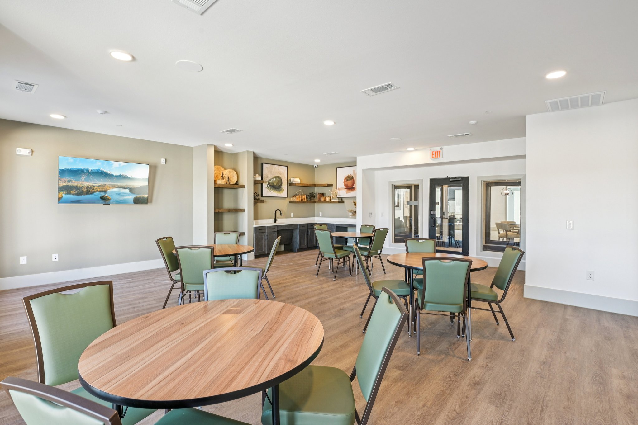 community kitchen with bar, tables and chairs