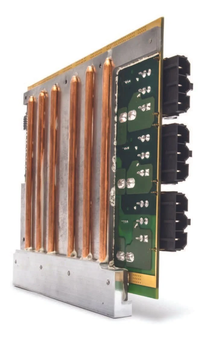 A computer hardware component with multiple copper heat pipes and a green circuit board visible on one side.