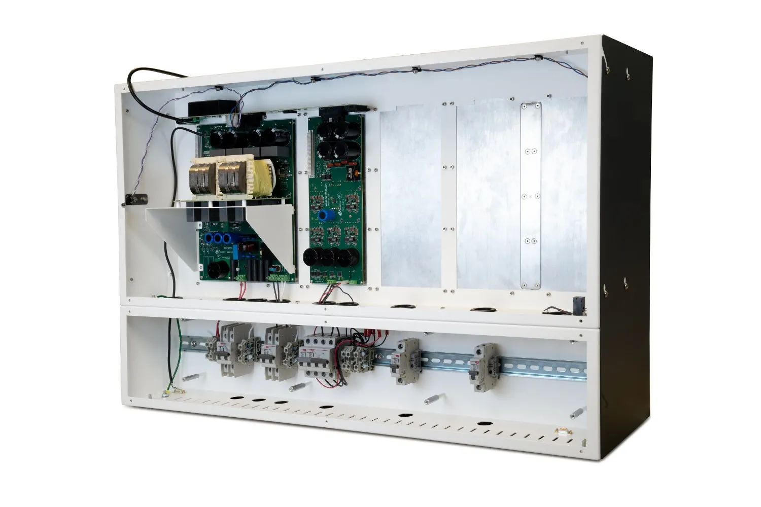 Open electrical control panel featuring circuit boards with capacitors and transformers on the top, and multiple circuit breakers mounted on a metal rail below.