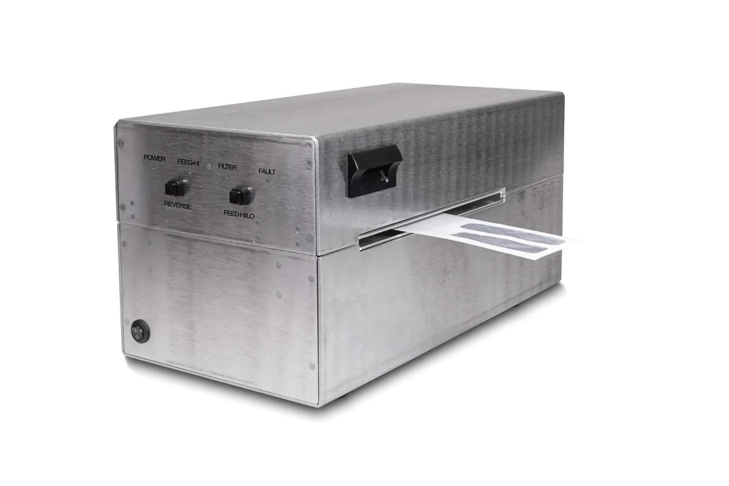 Metal device with control knobs and a slot, ejecting a strip with gray patterns.