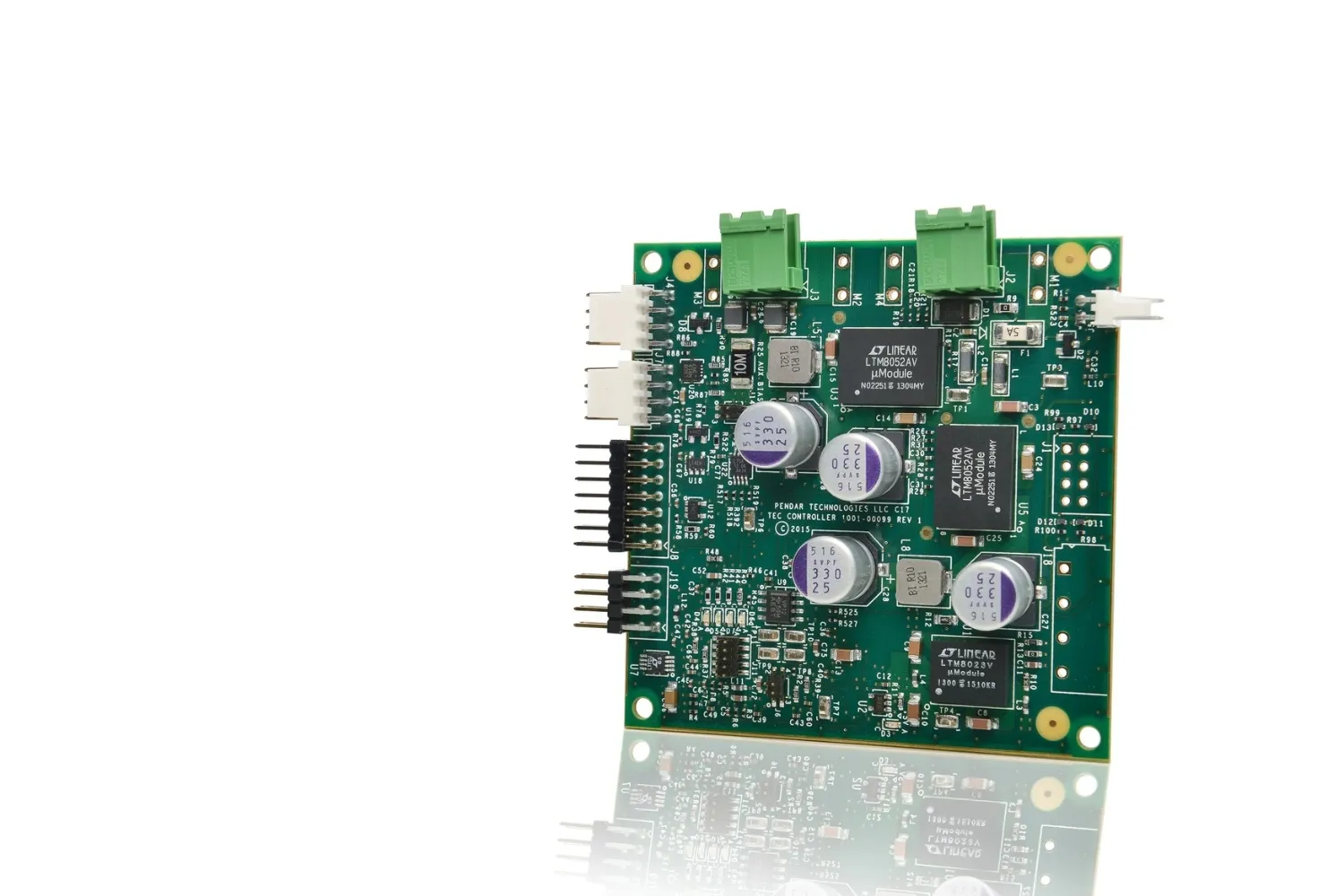 Green printed circuit board with capacitors, connectors, and multiple integrated circuits including Linear Technology chips.