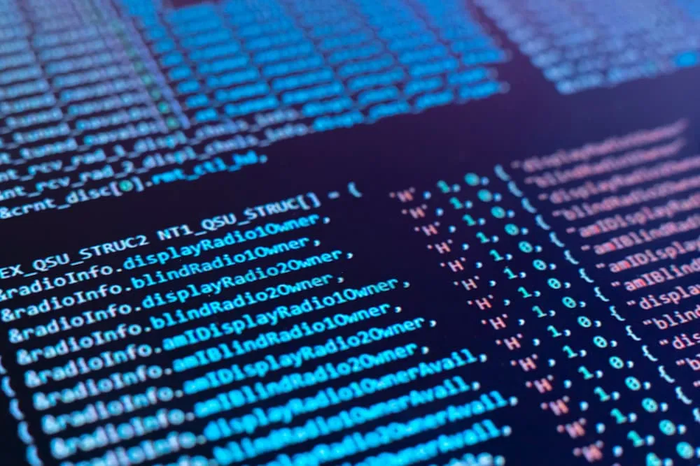 Close-up of computer screen displaying colorful lines of programming code.