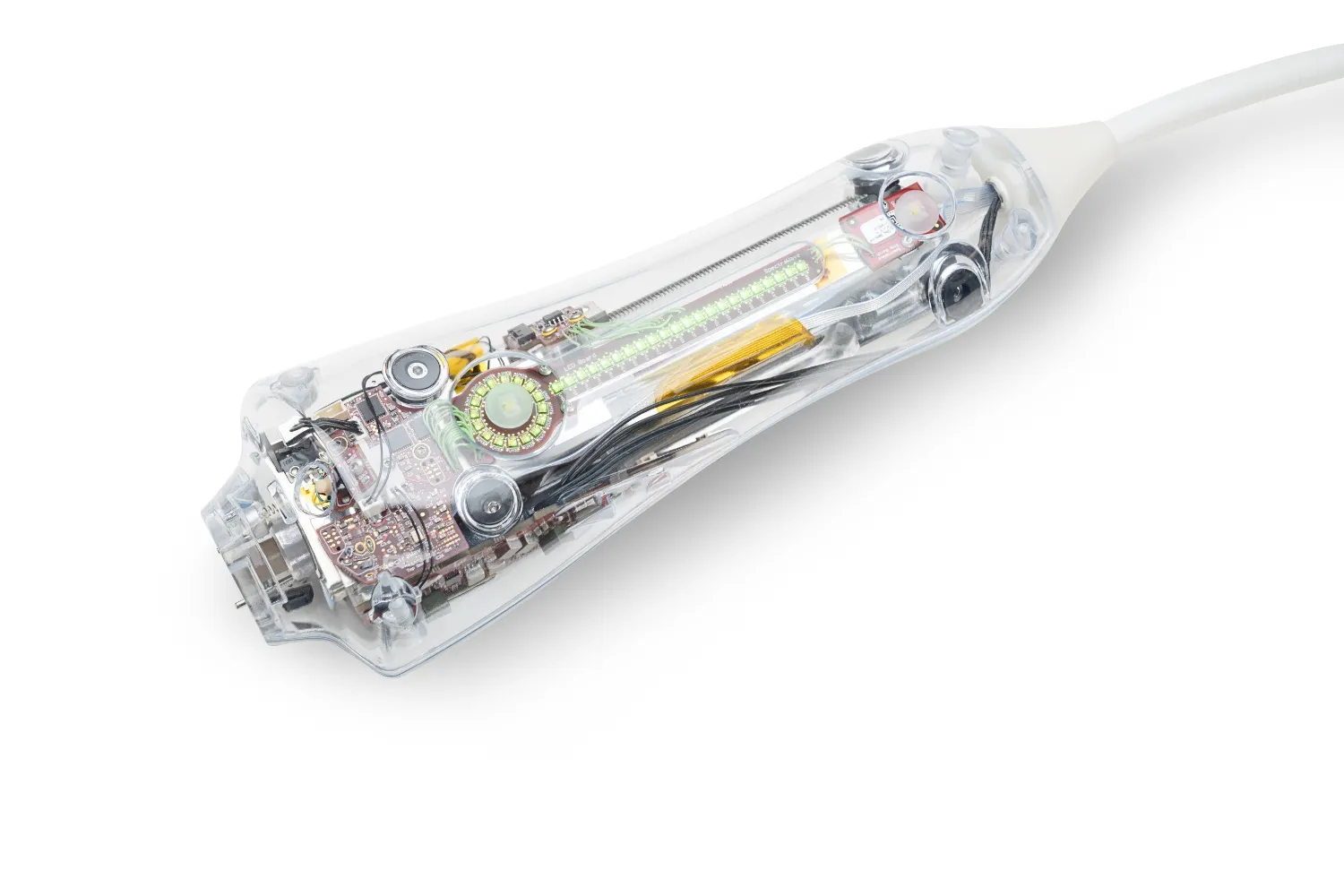 Transparent electronic device casing showing internal circuit board, wires, and components.