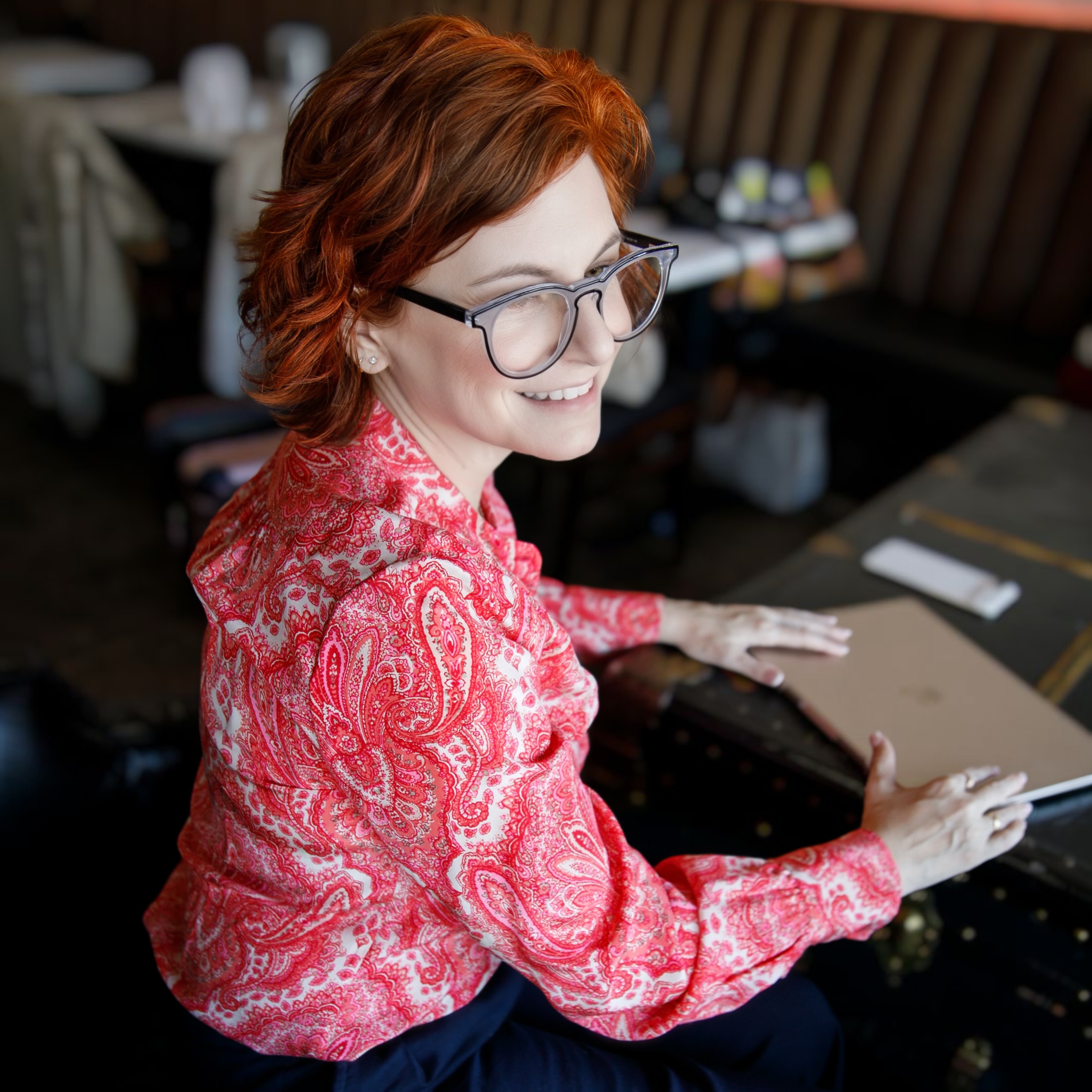 An image of ARLA Strategies founder Alia Luria working on her laptop.