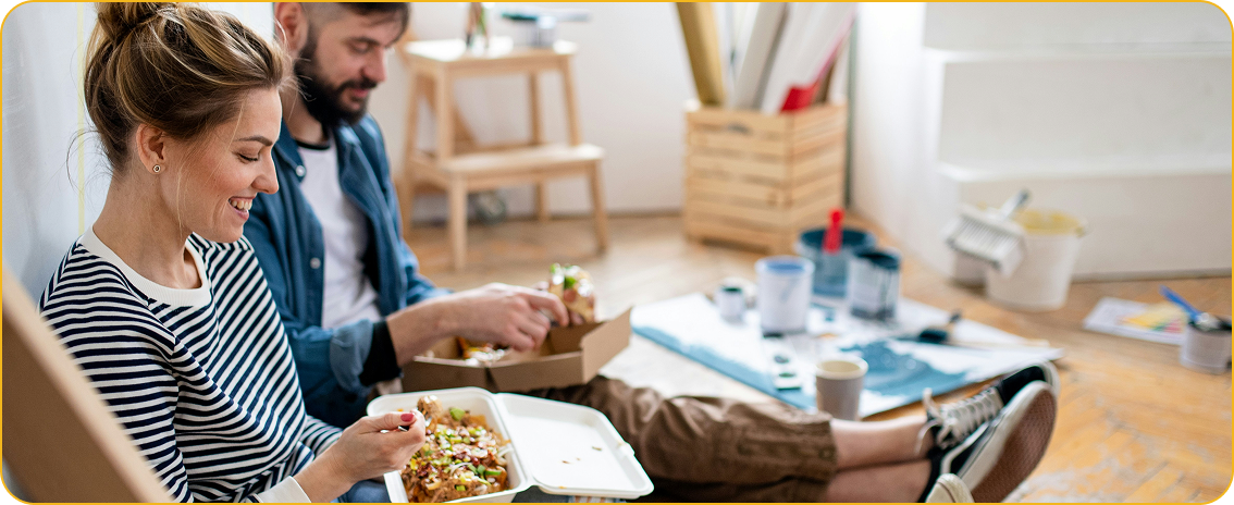 Two peoples eating food