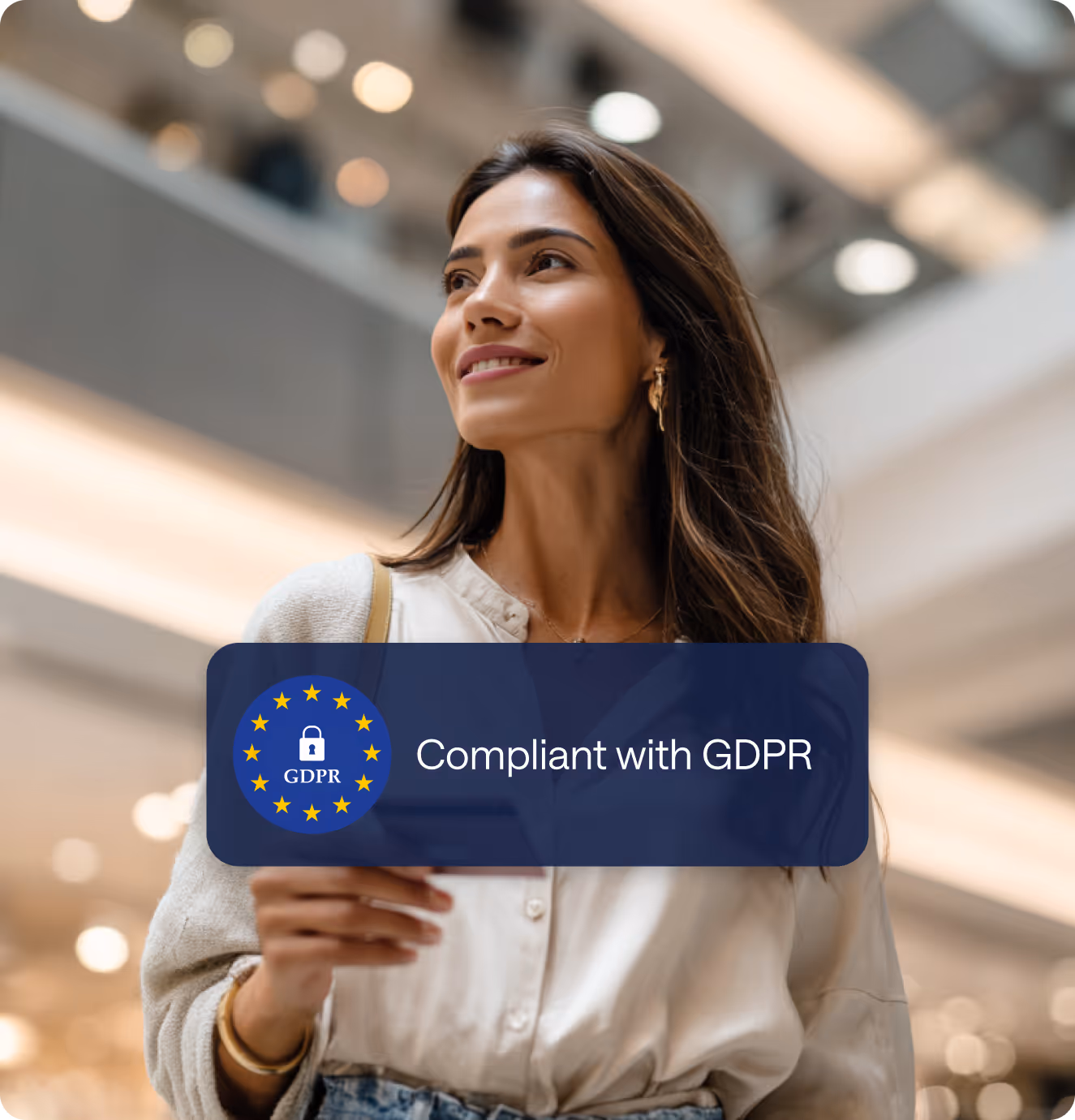 Smiling woman holding a card or document with a GDPR compliance badge overlay stating 'Uppfyller kraven enligt GDPR'.