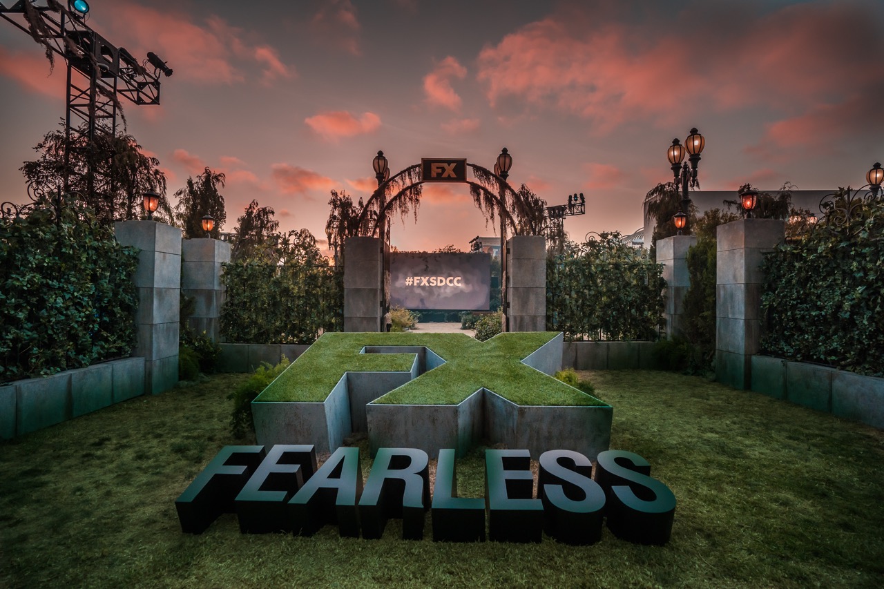 Opening gates, street lamps, and a large sign reading "FX Fearless", this is the opening of a haunted maze activation at Sand Diego Comic-Con