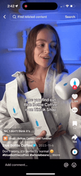 Woman holding Blue Bottle Coffee bags and a white coffee tumbler, overlay text reads 'pov: you find out Blue Bottle Coffee is on TikTok Shop.'
