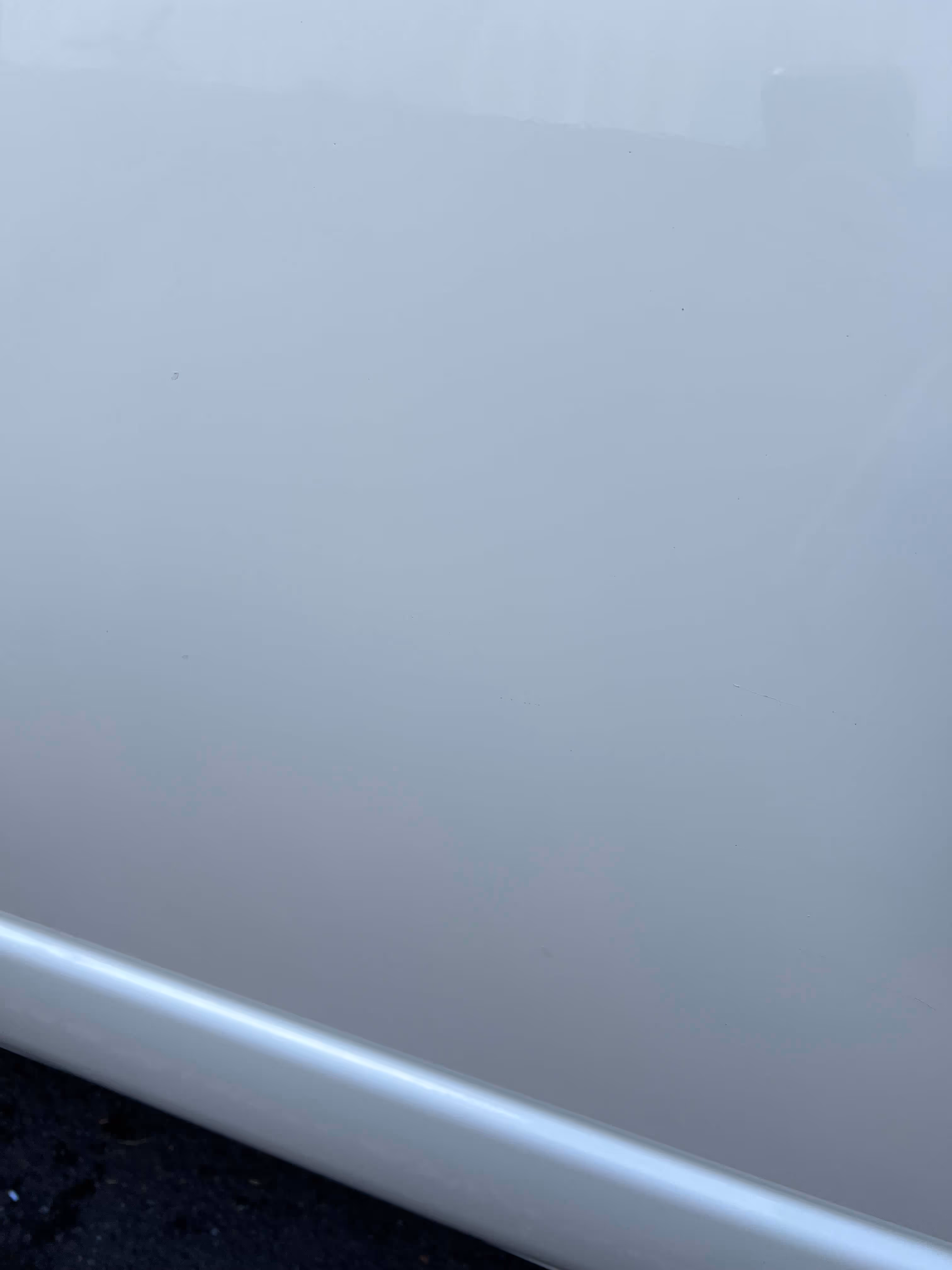 Final exterior paintwork finish photo after vehicle decal signage is removed, paintwork cleaned and polished, all traces of sticker/decal have been removed.