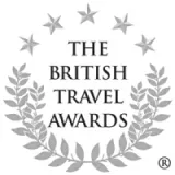 The British Travel Awards logo with stars forming a circle above laurel wreaths below.